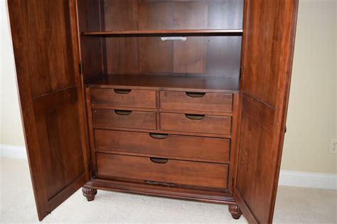 Upper storage drawer. . Ethan allen armoire